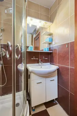 a bathroom with a sink and a shower at Cihan Apartment in Budva