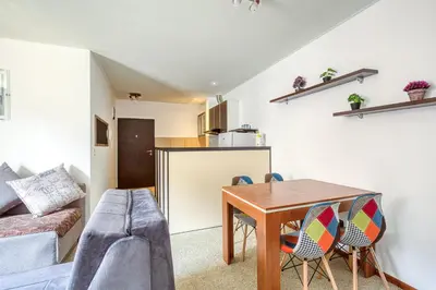 a living room with a table and a couch at Cihan Apartment in Budva