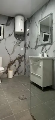 a bathroom with a sink and a mirror at Stanovi VR in Bar