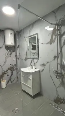 a bathroom with a sink and a mirror at Stanovi VR in Bar