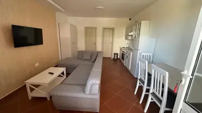a small living room with a couch and a table at Stanovi VR in Bar