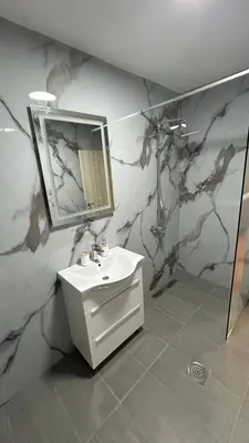 a bathroom with a sink and a mirror at Stanovi VR in Bar