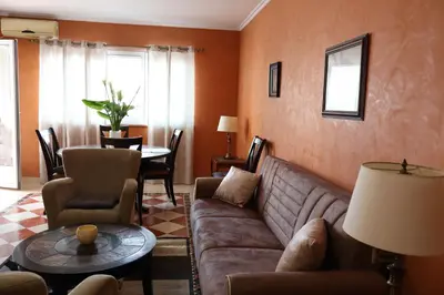 a living room with a couch and a table at Apartment Lux in Bar