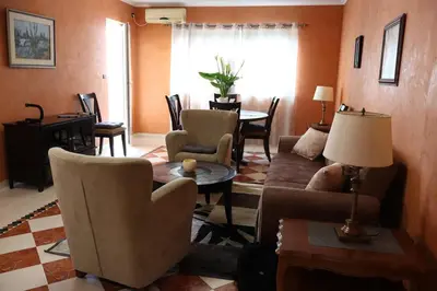 a living room with a couch and chairs and a table at Apartment Lux in Bar