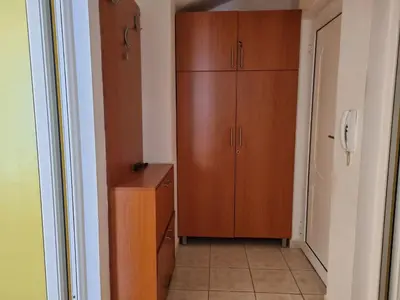 a room with a closet and a wooden cabinet at Apartment Natasha in Petrovac na Moru