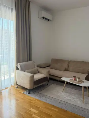 a living room with a couch and a table at Apartman Luka in Bar