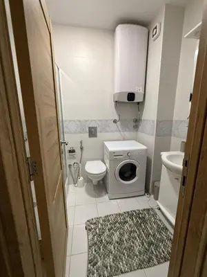a small bathroom with a toilet and a sink at Apartman Luka in Bar