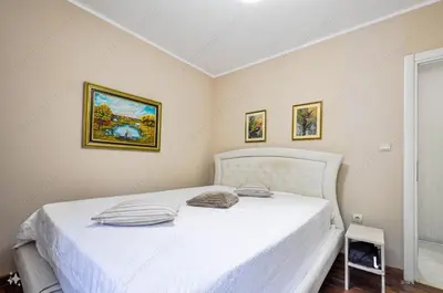 a bedroom with a white bed in a room at Sunset in Kotor