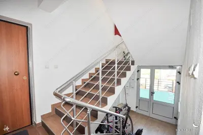 a spiral staircase in a house with a bike at Sunset in Kotor