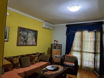 a living room with a couch and a table at Holiday 2 in Kotor