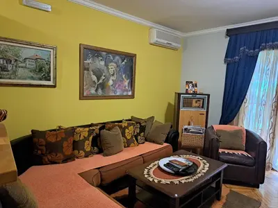 a living room with a couch and a table at Holiday 2 in Kotor