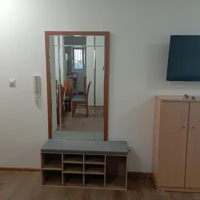 a room with a mirror and a table and a tv at Nice summer apartment near sea in Budva