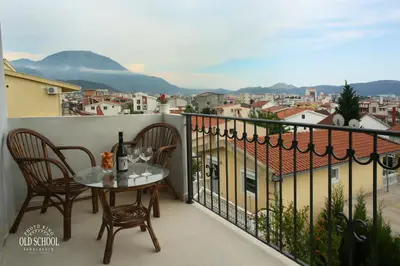 a balcony with a table and chairs and a view at Aparthotel Monterria in Bar