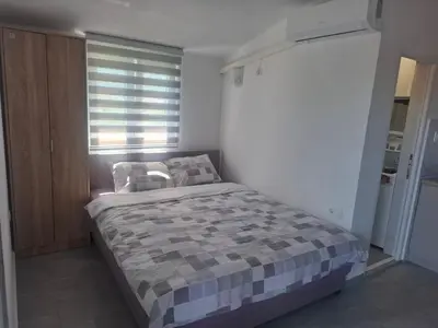 a bedroom with a bed and a window at Apartman Andjela 1 in Budva