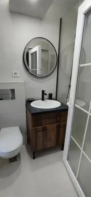 a bathroom with a sink and a mirror and a toilet at Jelena Lapčići Budva in Budva