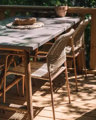 a wooden table and chairs on a patio at Oak Cabin in Ulcinj