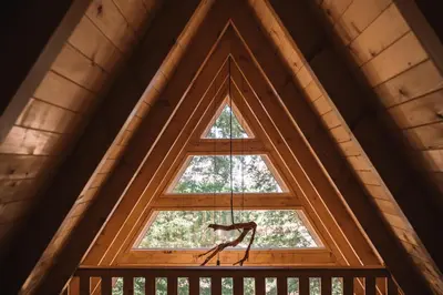 a window in a cabin with a sculpture in front of it at Oak Cabin in Ulcinj