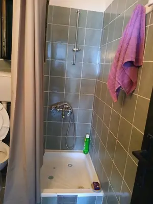 a bathroom with a shower with a bath tub at MonaLiza in Ulcinj