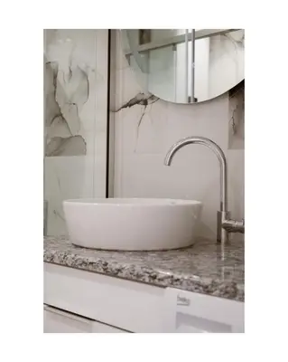 a bathroom with a white sink on a counter at Sea&Sun Living in Ulcinj