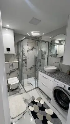 a bathroom with a sink and a washing machine at Sea&Sun Living in Ulcinj