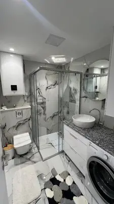 a bathroom with a sink and a washing machine at Sea&Sun Living in Ulcinj