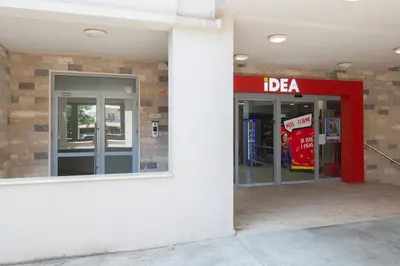 a gas station entrance with a bfa sign on the wall at Lovely onebedroom Becici in Becici