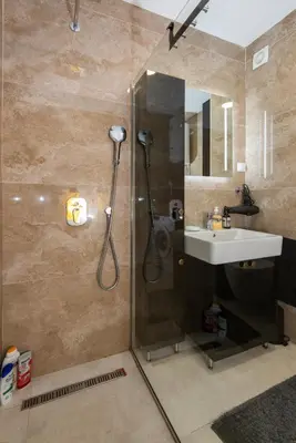 a bathroom with a shower and a sink at Lovely onebedroom Becici in Becici