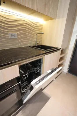 an empty kitchen with a sink and a dishwasher at Ornament Liman - Infinity Pool with Old Town View Apartments in Ulcinj
