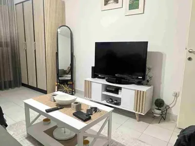 a living room with a tv and a table at Sivas Bar in Bar