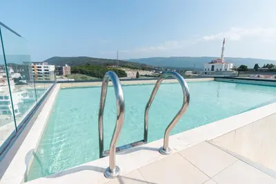 a view of a swimming pool from the balcony of a building at Serene Escape in Ulcinj