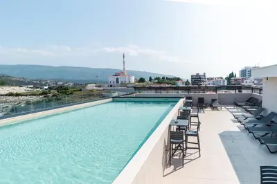 a swimming pool on the roof of a building at Serene Escape in Ulcinj