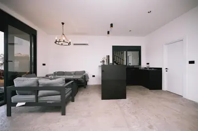 a living room with a couch and a table at Casa Rio in Ulcinj
