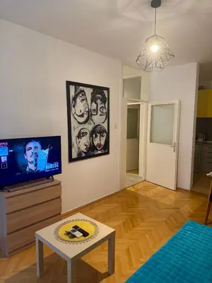 a living room with a tv and a table at Top-Top 2 in Podgorica