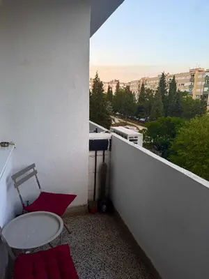 a balcony with a toilet on the side of a building at Top-Top 2 in Podgorica