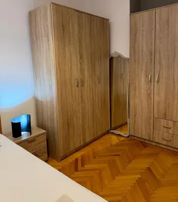 a room with wooden cabinets and a wooden floor at Top-Top 2 in Podgorica