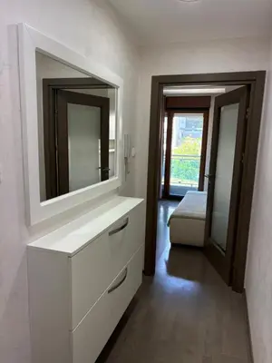 a bathroom with a white dresser and a mirror at Njaro Del Mar Studio 13 in Petrovac na Moru