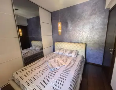 a bedroom with two beds and a mirror at City View 7 - Budva Center in Budva