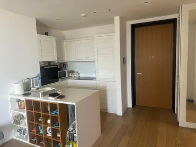 a kitchen with white cabinets and a counter top at Dukley Residence Budva Old Town in Budva