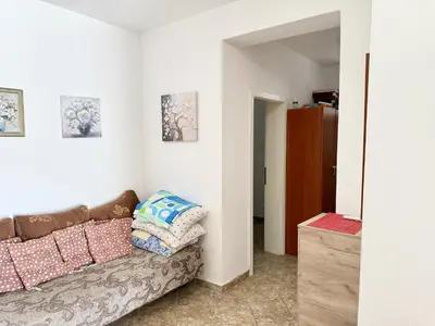 a living room with a couch with pillows on it at Sutomore Two Bedroom Apartment in Sutomore