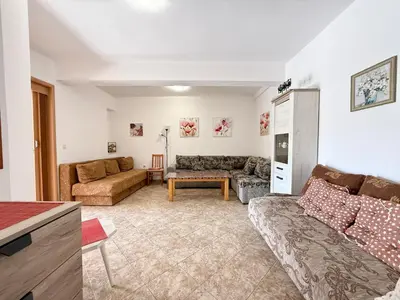 a living room with a couch and a table at Sutomore Two Bedroom Apartment in Sutomore