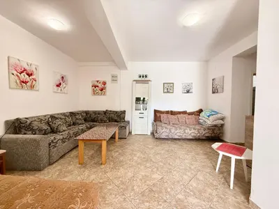 a living room with a couch and a table at Sutomore Two Bedroom Apartment in Sutomore