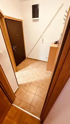 a hallway with a door and a tiled floor at Budva Summer House in Budva