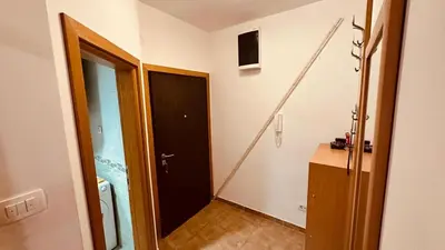 a hallway with a bathroom with a black door at Budva Summer House in Budva