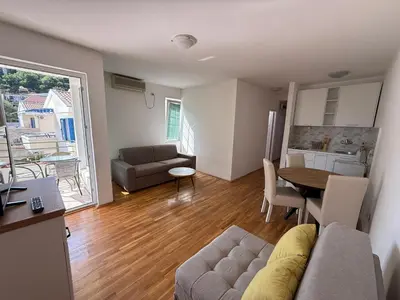 a living room with a couch and a table at Jadran Rafailovic in Rafailovici