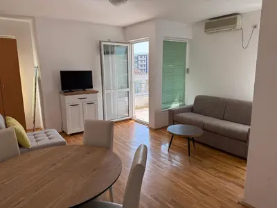 a living room with a couch and a table at Jadran Rafailovic in Rafailovici