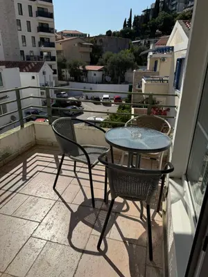 a table and chairs on a balcony with a view at Jadran Rafailovic in Rafailovici