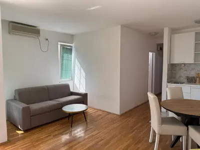 a living room with a couch and a table at Jadran Rafailovic in Rafailovici