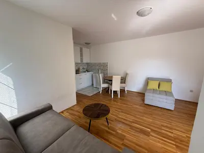 a living room with a couch and a table at Jadran Rafailovic in Rafailovici