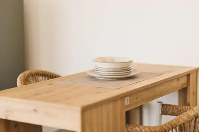 a wooden table with a bowl on top of it at SeaSide Luxury Apartments in Ulcinj