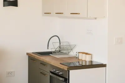 a kitchen with a sink and a counter top at SeaSide Luxury Apartments in Ulcinj
